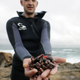 A ‘percebeiro’ shows his Goose barnacles hunted ahead of Christmas celebrations in the rough waters of Cape Roncudo.